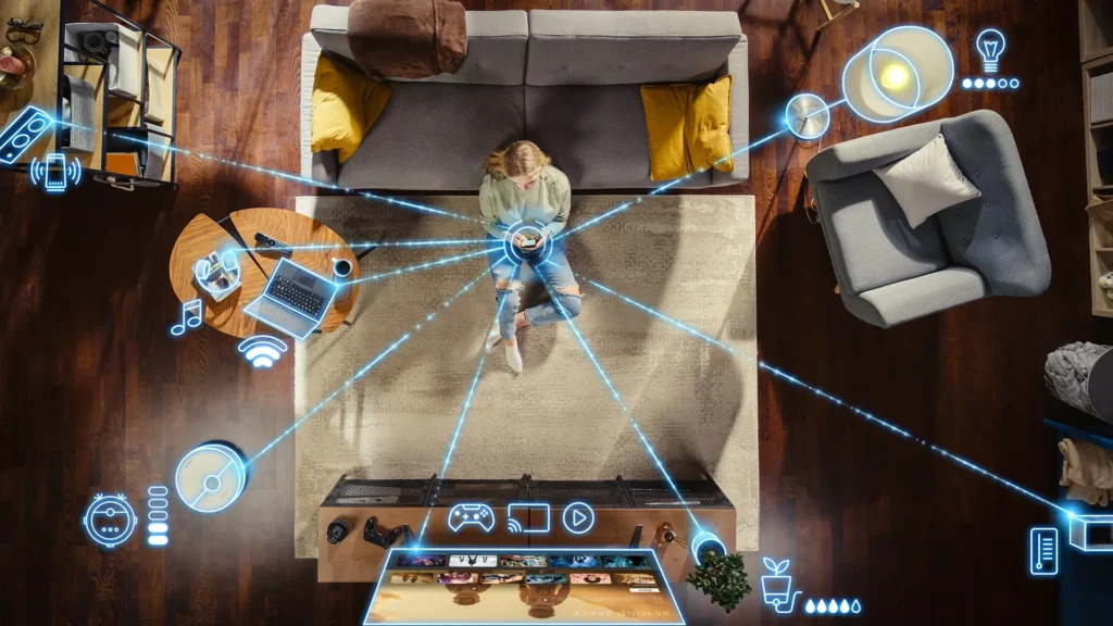 An overhead view of a woman using a smartphone in a living room, with a network of digital icons and lines connecting to smart home devices like lights, a TV, and a laptop.